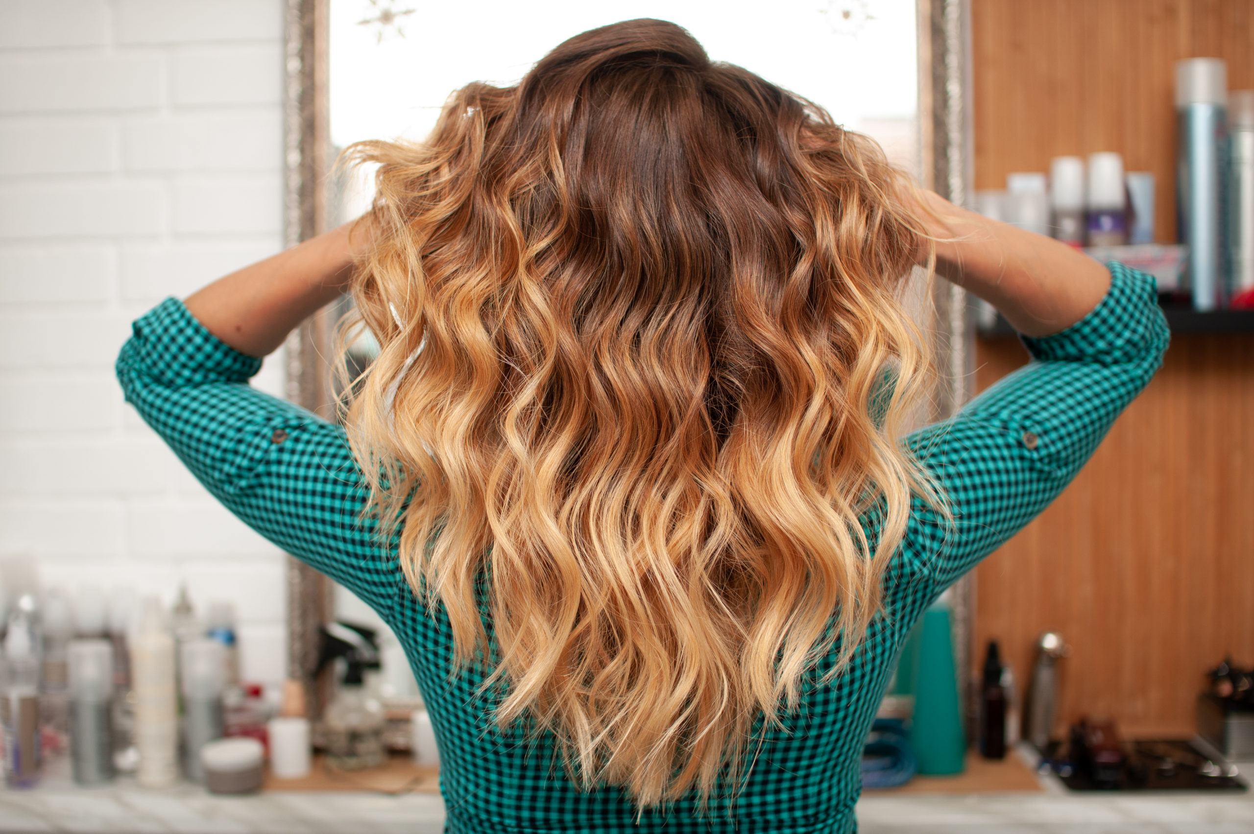 Beautiful ombre hair coloring on a girl with long hair, view from the back