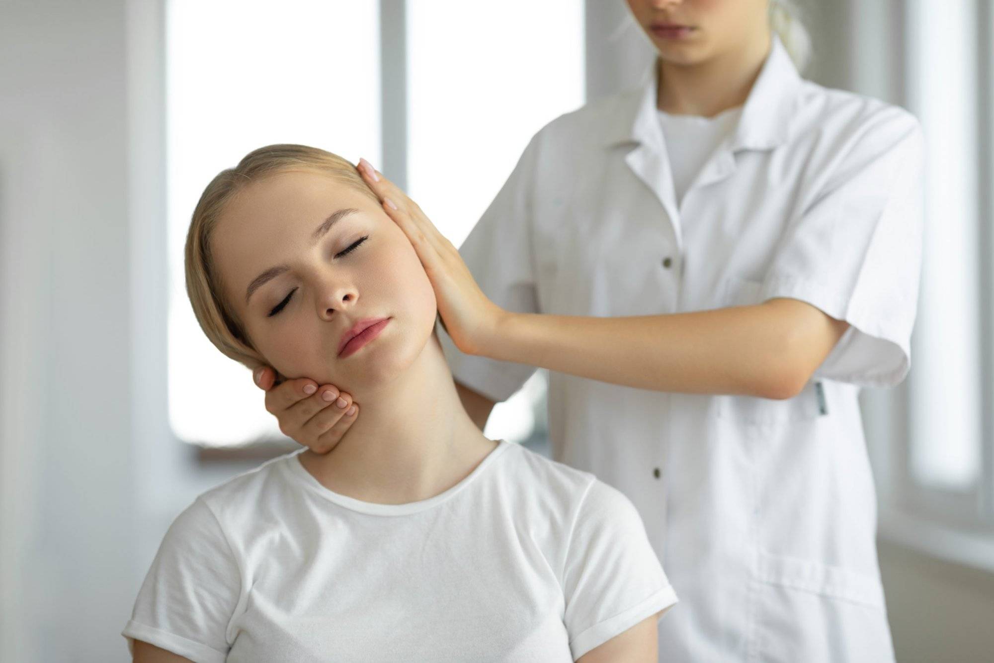 Chiropractor doing adjustment on female patient