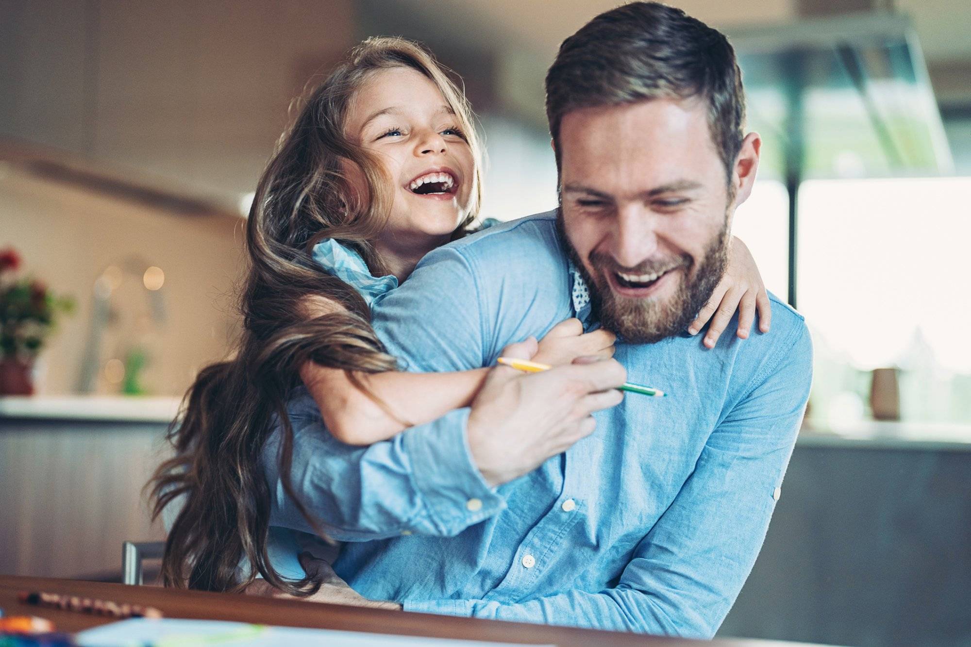 Father and daughter having fun at home